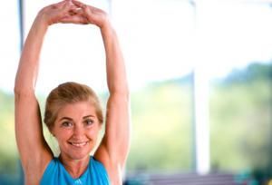 webmd photo of trainer flexing arms